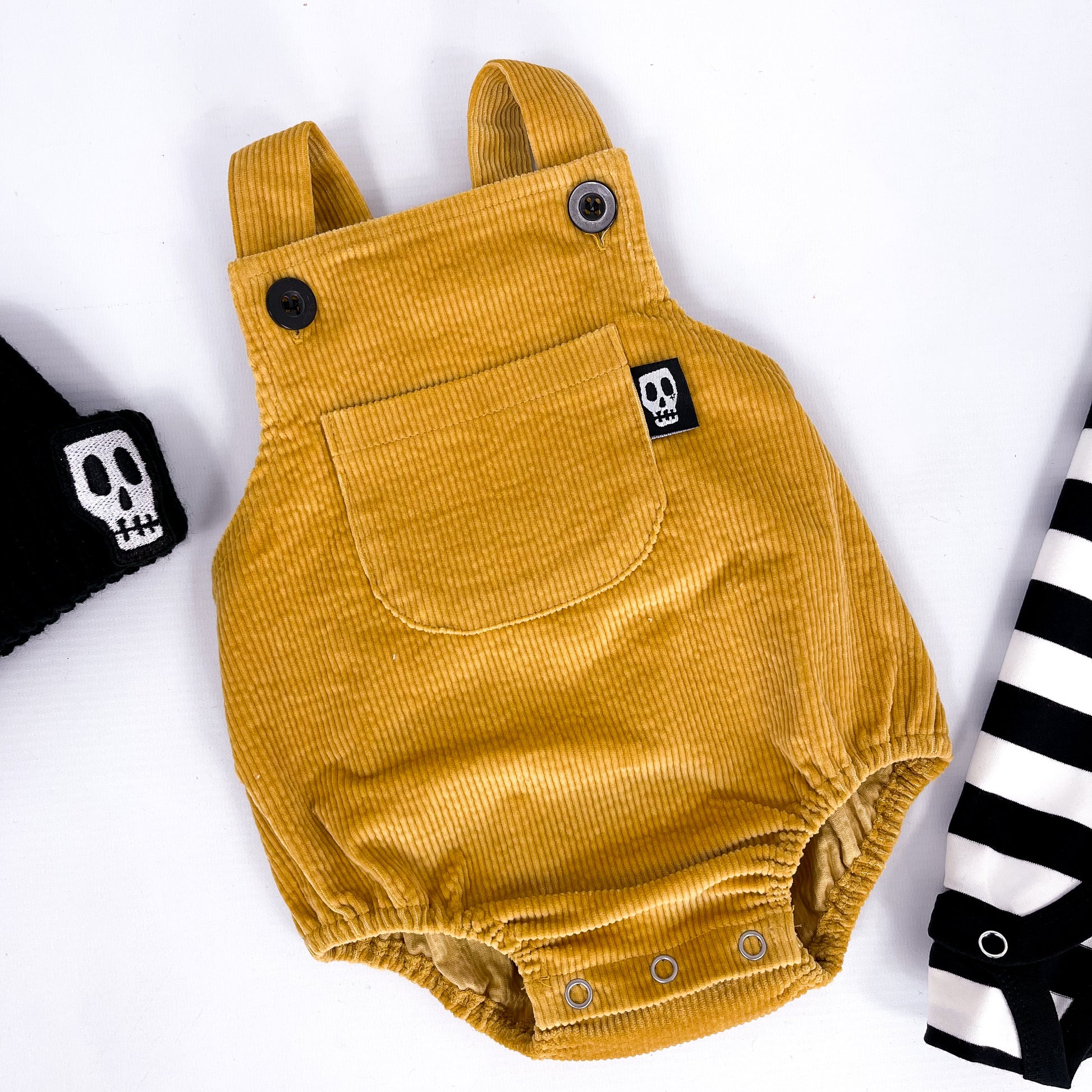 Mustard yellow cord baby romper with front bib pocket