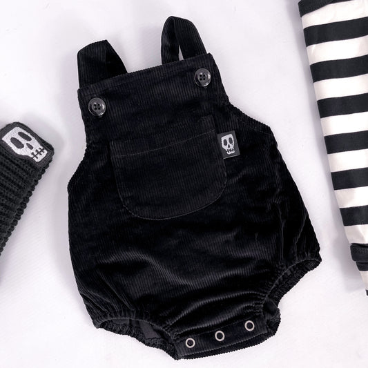 Black cord baby romper with front bib pocket