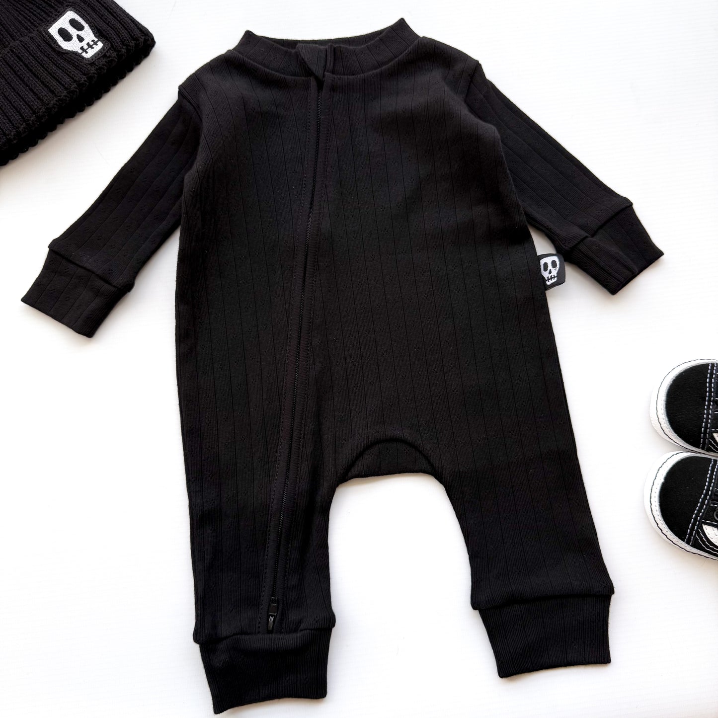 BABY POINTELLE BLACK ZIP UP FOOTLESS ROMPER