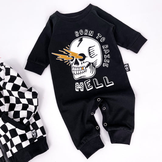 Black baby romper with "born to raise hell" printed on and a design of a skull shooting lightning bolts from its eye sockets