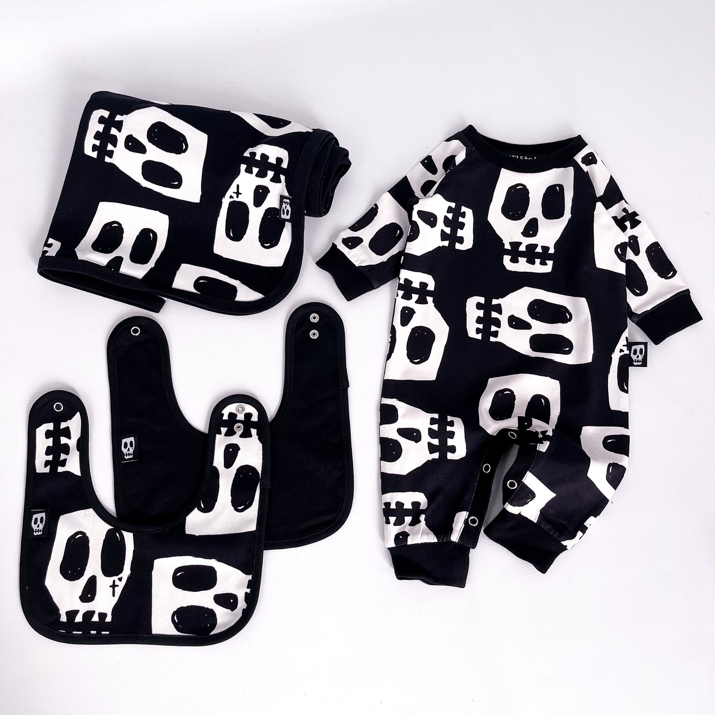SKELLY SKULL FOOTLESS ROMPER
