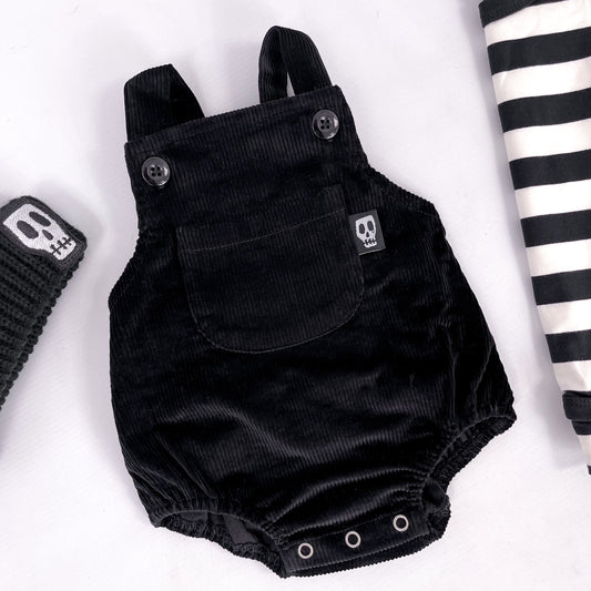 Black cord baby romper with front bib pocket 