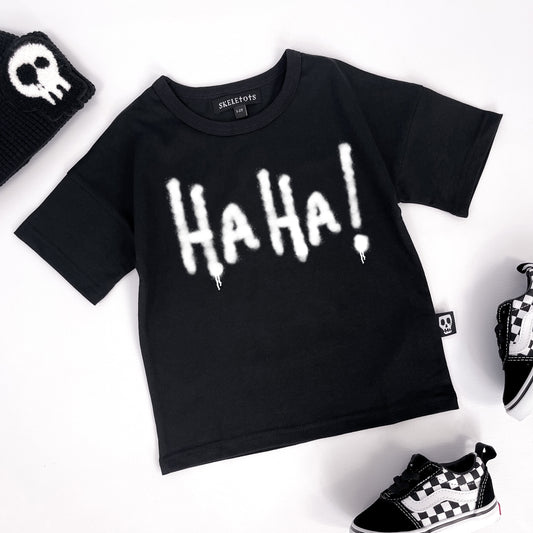 Kids black t shirt with "Ha ha!" printed on graffiti style
