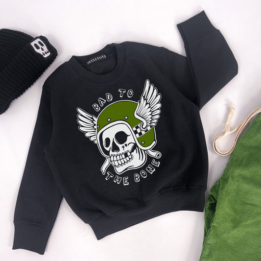 Kids black sweatshirt with "bad to the bone" printed on and a design of a skull in a winged helmet
