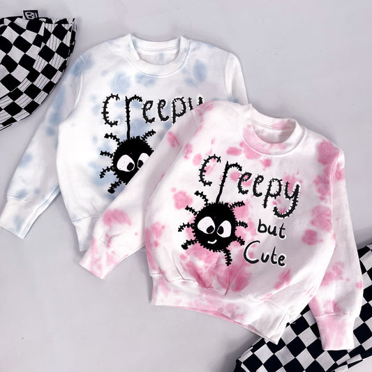 Kids tie dye pink sweatshirt with cute spider and "creepy but cute" printed on
