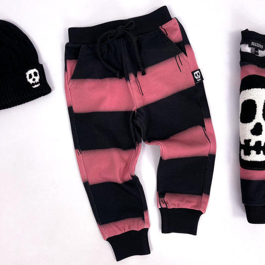 Kids black and pink striped slim fit joggers with dripping paint design