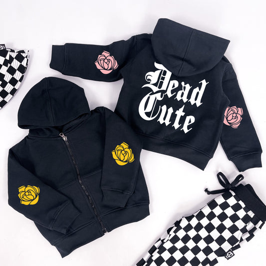 Kids hoodie with "Dead Cute" printed on and rose designs on the sleeves