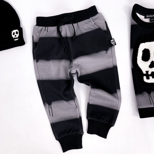 Kids black and grey striped slim fit joggers with dripping paint design