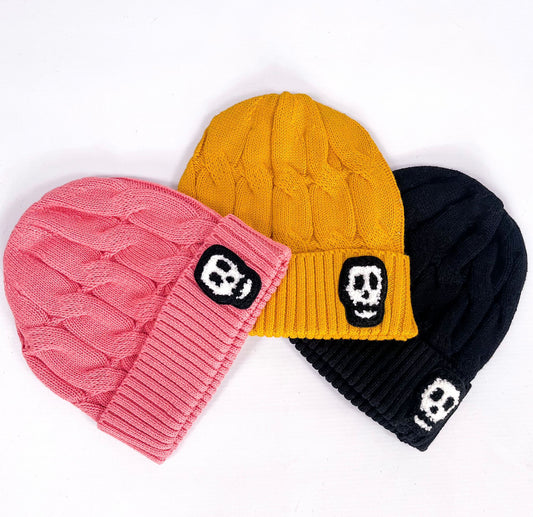 Kids knitted cotton beanies with skull logo, available in black, dusky pink and mustard yellow