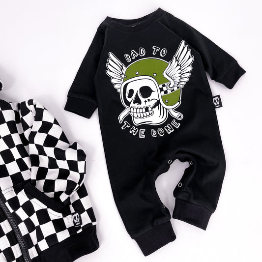 Black baby romper with "bad to the bone" printed on and a design of a skull in a winged helmet