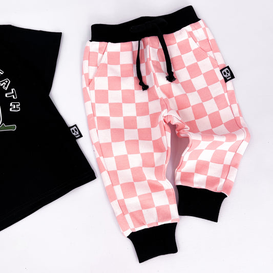 Kids joggers with pink and white checkerboard design