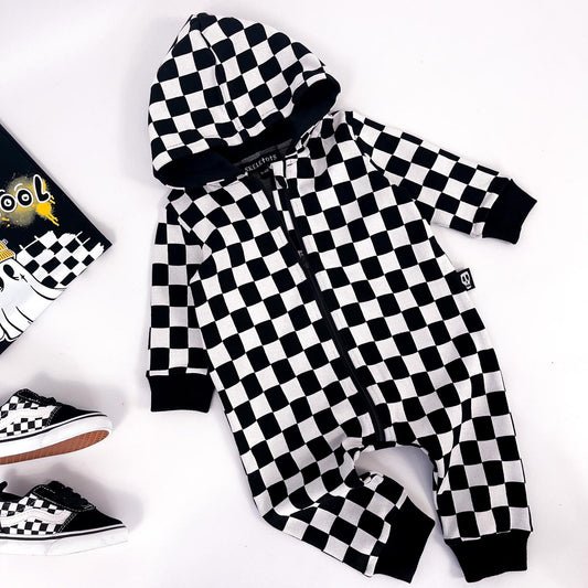 Kids zip up all in one in checkerboard black and white