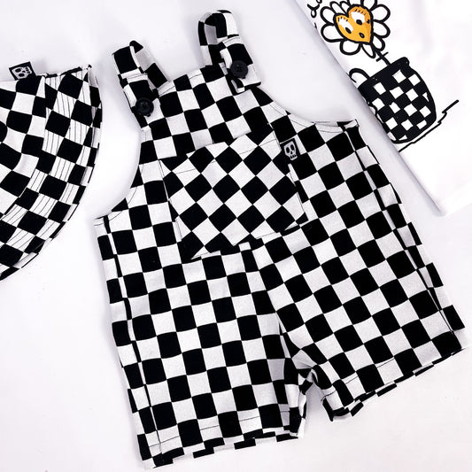 Kids short dungarees in checkerboard style white and black