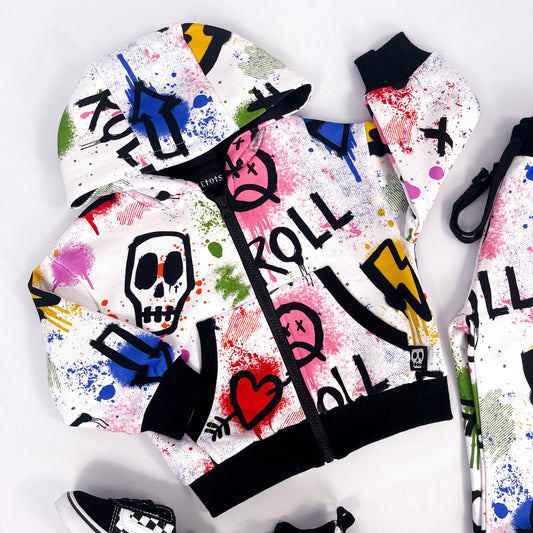 Kids white hooded jacket with colourful graffiti print skulls, hearts, lightning bolts and paint splatter