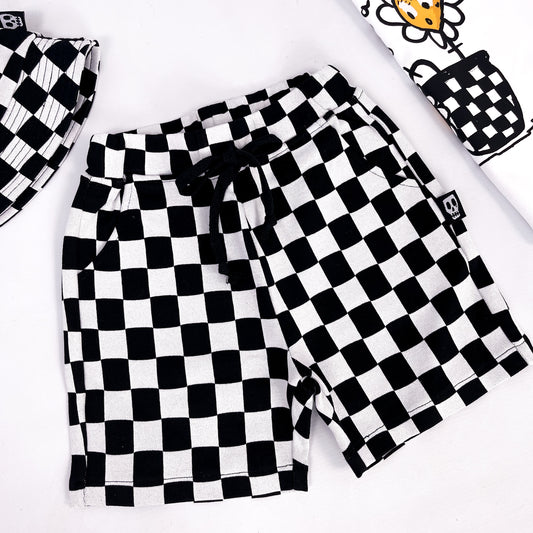 Kids shorts in checkerboard style white and black