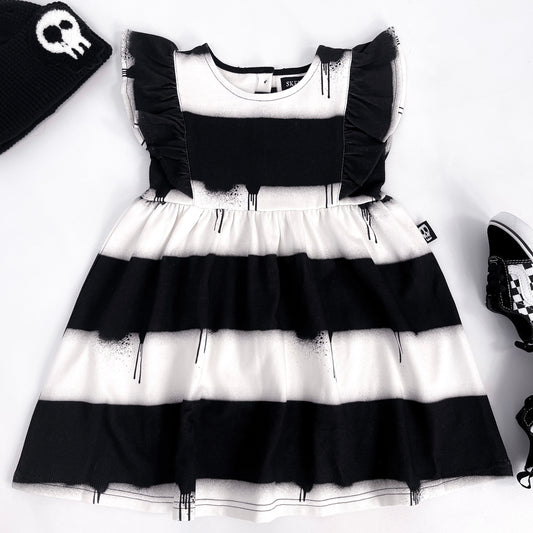Kids black and white striped dress with frilled sleeves and dripping paint design
