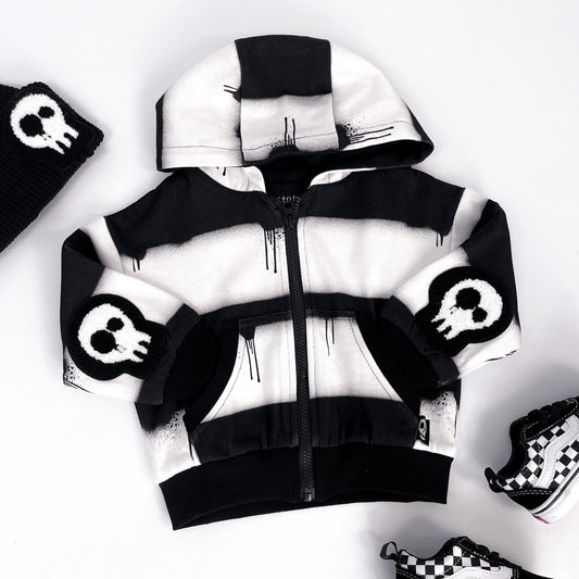 Kids black and white striped hoodie with skull patches and dripping paint design