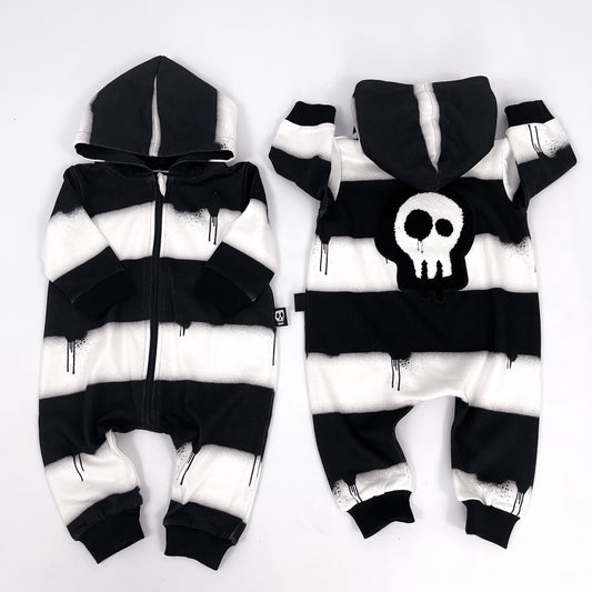 Kids black and white striped zip up all in one with dripping paint design