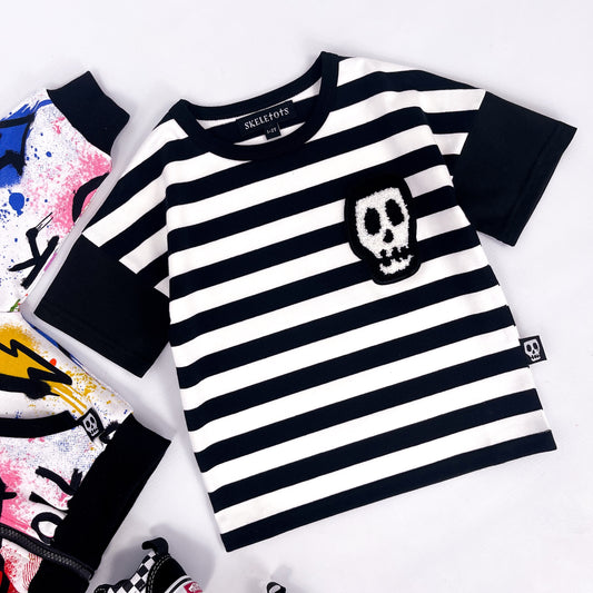 Kids black and white striped tee shirt with skull patch