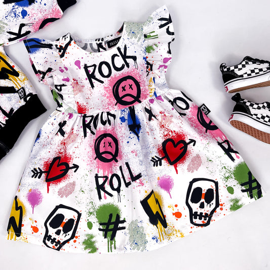 Frilled sleeve child's dress with colourful graffiti print skulls, hearts, lightning bolts and paint splatter