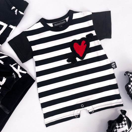 Black and white striped baby romper with love heart patch