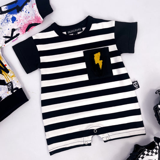 Black and white striped baby romper with lightning bolt patch