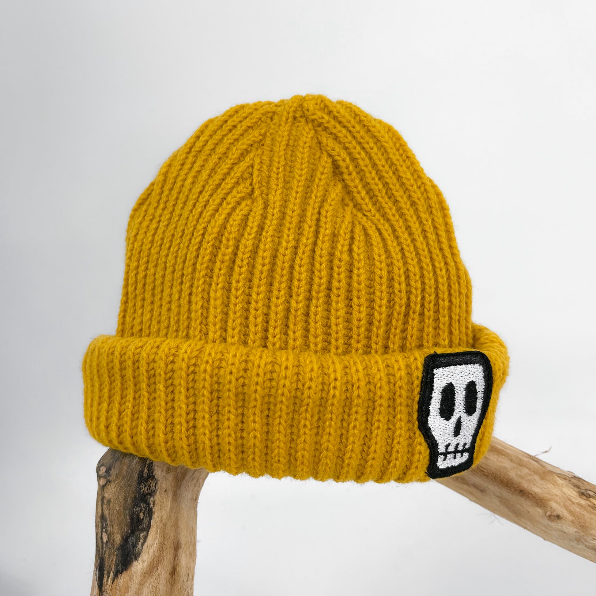 Kids trawler beanie, mustard yellow with embroidered Skelly Skull logo 