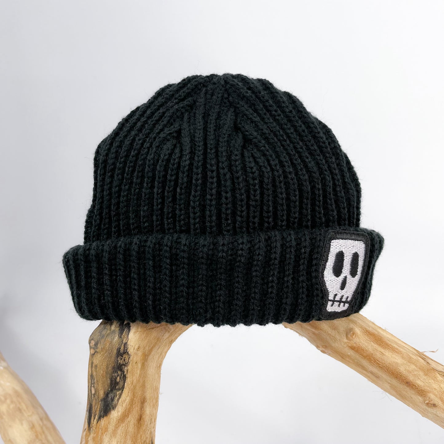 Kids trawler beanie, black with embroidered Skelly Skull logo 