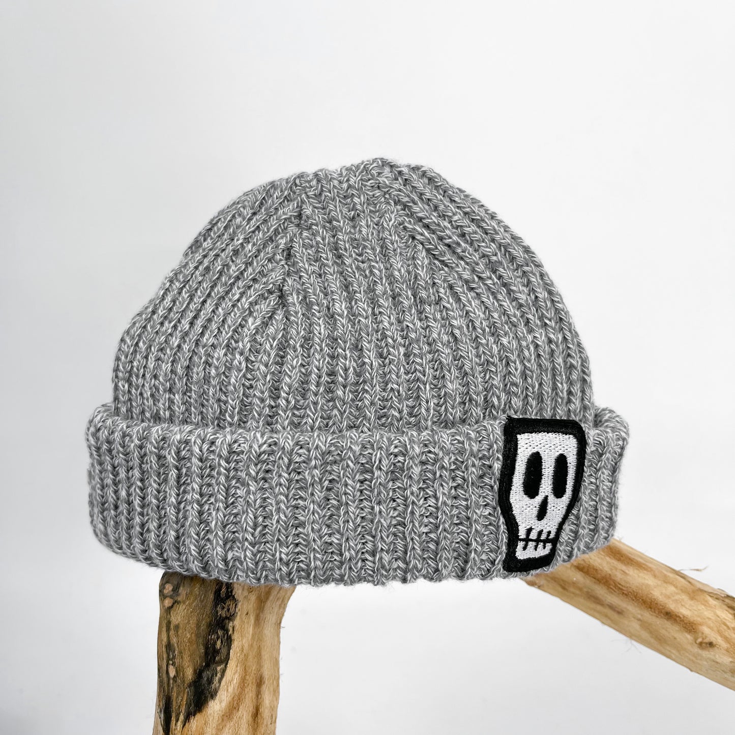 Kids trawler beanie, grey with embroidered Skelly Skull logo 